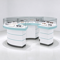 Vitrine de magasin d'optique en verre blanc avec pieds en tube doré, barre lumineuse et protection en verre, certifiée CE ETL pour opticien
