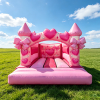 Château gonflable rose de qualité commerciale, décoré d'un nœud en forme de cœur, petit château gonflable pour les fêtes de filles