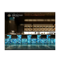 Comptoir de bar en pierre d'agate bleue rétroéclairée avec design commercial, idéal pour les bars, les discothèques et les restaurants