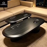 Table basse ovale haut de gamme en placage de bois noir avec incrustation de marbre pour la décoration intérieure de villas de luxe