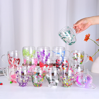Vente en gros de tasses en verre à double paroi en borosilicate de haute qualité, résistantes à la chaleur, avec fleurs séchées