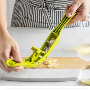 Multifunctional Plastic Garlic Press and Peeler 2 in 1 Manual Kitchen <b>Tool</b> with Wide Handle and Double Slot Chopper Mincer - Product Image 5