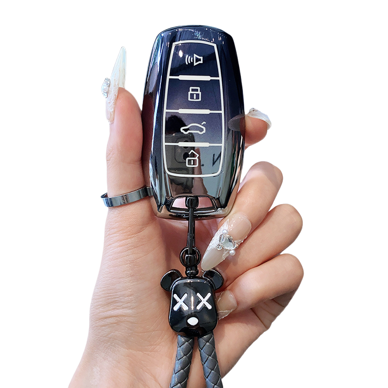 4 boutons noir + porte-clés