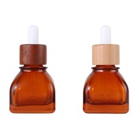Botol Minyak Esensial Kosong Bentuk Persegi Amber 30ml Kelas Atas Baru dengan Penutup Kayu Bambu untuk Kemasan Cairan Esens