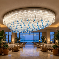Lustre en cristal de designer, coquille ovale en verre transparent, gouttes bleues, luxe pour projets d'intérieur de maisons et d'hôtels, vente en gros, sur mesure