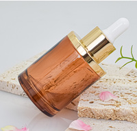 Conteneur de bouteilles cosmétiques de luxe collier en or compte-gouttes de sérum en verre rond cylindrique 30mL 50mL pour les produits cosmétiques de soin