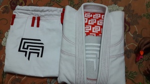 100% algodón perla tejido BJJ GI personalizado Jiu Jitsu Gi con Pantalón de sarga y Rashguard corto para Judo artes marciales al por mayor - Product Image 4