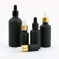 Vente en gros de flacons compte-gouttes en verre transparent bleu vert noir ronds personnalisés avec logo pour cosmétiques et huiles essentielles 30 ml transparent