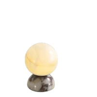 Lampe de table en marbre transfrontalière pour chambre à coucher, style luxe léger haut de gamme, nouvelle lumière d'ambiance en jade style Bulgari pour la pièce.