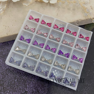 แพ็คผสม 20 ช่อง ใหม่ ปี 2023 ขายส่ง อุปกรณ์ตกแต่งเล็บ 3 มิติ โบว์ DIY สำหรับร้านเสริมสวย - Product Image 5