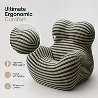 Fauteuil à bascule UP5 iconique et moderne, style italien de luxe léger, avec repose-pieds sphérique, idéal pour salon, chambre et espace détente.