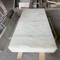 Marbre blanc naturel poli translucide de luxe pour tables basses, éviers, luminaires, escaliers et applications hôtelières