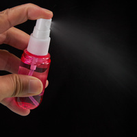 Flacon pulvérisateur de parfum de poche rond en plastique de 20 ml avec logo personnalisé, idéal pour les voyages, avec pompe à brume et porte-clés