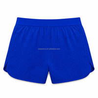 Shorts de sport légers et sans coutures pour hommes, perforés, séchage rapide, respirants, pour la course et la gym, avec design à jambes fendues, personnalisables OEM