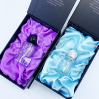 Flacons de parfum cylindriques en verre personnalisés de 30 ml et 50 ml avec des matériaux recyclés, un revêtement en éponge, des boîtes en carton et des étiquettes adhésives