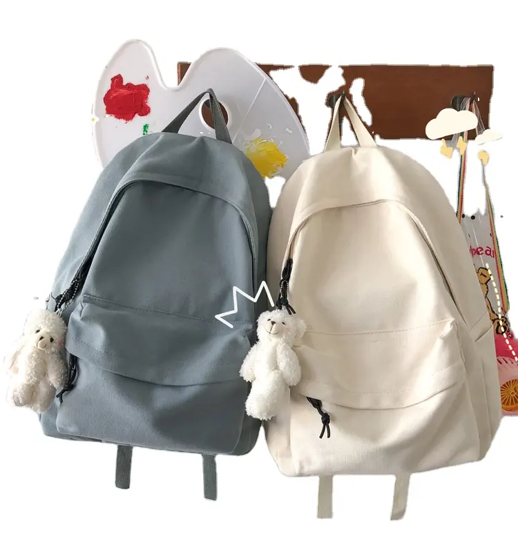 Venta al por mayor de fábrica, modelo elegante, mochila escolar de lona de algodón de alta calidad con bolsillo para portátil