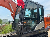 Excavatrice sur pneus d'occasion Hitachi ZX 130 de 13 tonnes, 98% neuve, excellente qualité, en stock