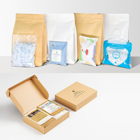 Le fabricant a développé un ensemble cadeau de déshumidification de quatre pièces Sac de déshumidificateur Sac de purification de charbon de bambou Gel de silice