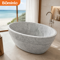 Baignoire autoportante circulaire en marbre blanc de qualité supérieure, à rebord cannelé, sculptée à la main, veinée de gris, pour hôtel, spa, villa