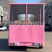 Bus de tourisme électrique rose, 17 places, véhicule de visite fermé avec sièges en cuir pour les excursions de villégiature, les mariages et les événements