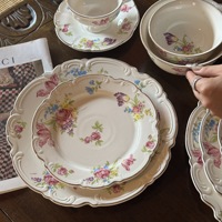 Nouvelle assiette ovale en céramique gaufrée à motif floral, style sud-ouest français, résistante au micro-ondes, pour desserts et présentation.