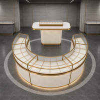 Comptoir d'exposition de bijoux en métal doré sur mesure avec éclairage LED pour magasin de détail et distributeur en gros
