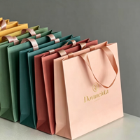 Sac à main de shopping haut de gamme en carton blanc, logo personnalisé ODM OEM, matériau épaissi résistant pour transporter 6-9 kg d'articles quotidiens