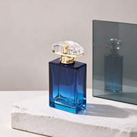 Flacon de parfum en verre bleu océan de 50 ml, corps carré à cadre encastré, couvercle en acrylique transparent pour Cologne marine et aquatique