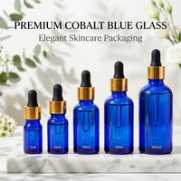 Bouteilles d'huile essentielle en verre ambré cylindriques bleues brillantes avec bouchon à vis en aluminium doré et compte-gouttes, sérum de haute qualité 10ml 30ml 50ml 100ml