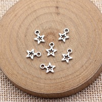 Colgante de estrella calada de 8.5x6.2mm de aleación de zinc plateado envejecido para la creación de collares celestiales