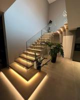 Escalier flottant droit à balustrade invisible avec éclairage LED, en acier et bois, pour loft