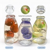 Bonbons durs aux fruits Chiboki en trois couleurs, série en forme de bouteille, remplissage de vaseline non-rétractable, boule faite à la main, vente directe d'usine
