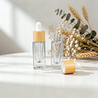 Vente en gros de flacons compte-gouttes en verre épais de luxe de 5 ml, flacons vides pour sérum avec col en bambou pour les soins de la peau, les parfums et les huiles essentielles