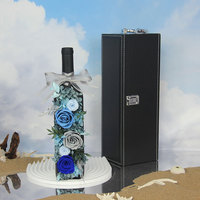 Vente en gros de fleurs et plantes éternelles préservées dans une bouteille de vin rouge, décoration d'intérieur, cadeau, rose en verre, fête des mères, remise de diplôme