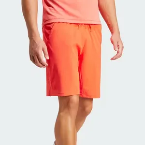 Fabrika doğrudan spor salonu elastik bant yan cep turuncu örgü nefes hızlı kuru bacak bölünmüş diz boyu şort erkekler için