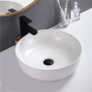 Großhandel moderne Porzellan Chaozhou Sanitär keramik weiß Waschbecken über Arbeits platte runde Keramik Waschbecken Hand waschbecken