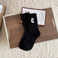 Chaussettes décontractées unies pour femme, en mélange de coton tricoté doux, taille unique, pour le quotidien, avec logo dessin animé