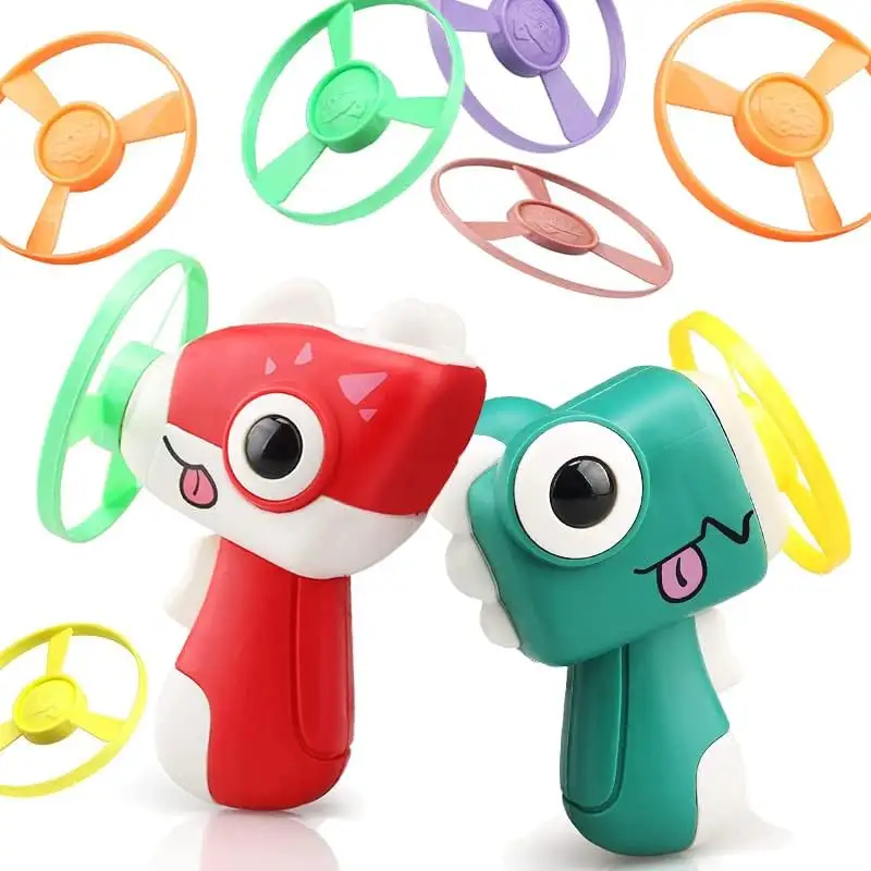 2023 New Kids Outdoor Toys 2 in 1 Dinosaurier-Flugs cheibe und Kreisel-Spielzeug pistole mit LED-Lichtern