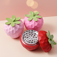 Moulins à herbes manuels en alliage de zinc, design fantaisie en forme de fraise, pour tabac et herbes sèches, vente en gros