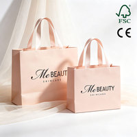 Sac de shopping en carton épais rose au design personnalisé unique, emballage de produits artisanaux de luxe avec poignée en ruban