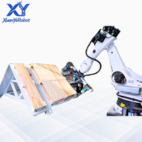 Ligne de production robotisée entièrement automatique pour le clouage de palettes en bois, poste de travail à double station pour l'assemblage, le clouage et l'empilage de palettes.