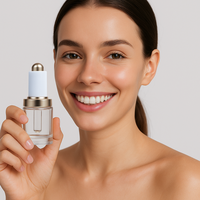 Flacon compte-gouttes en verre transparent de 30ml pour le visage et le corps avec couvercle en or blanc de luxe personnalisé pour cosmétiques