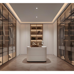 Dressing sur mesure de luxe avec portes vitrées modernes et commode à tiroirs orange, éclairage LED - Product Image 3