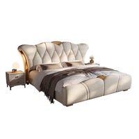 Lit double moderne de luxe léger avec revêtement en cuir véritable et cadre en bois, lit de rangement idéal pour appartement et hôtel