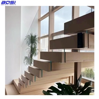 Escalier flottant en spirale moderne BOSI BI-L001 en acier au carbone avec marches en bois massif, pour salon, avec poutre de support, finition thermolaquée