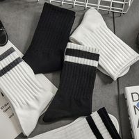 Chaussettes de sport unisexes mi-tube à tricoter avec logo à la mode pour hommes et femmes