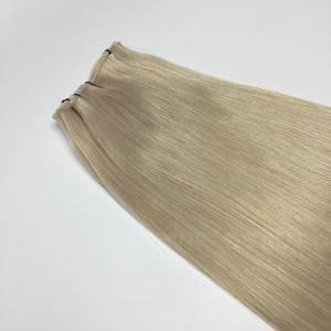 ผมต่อแบบเวอร์จินรัสเซียแท้ เกรด 60a ชนิด Genius Weft สีบลอนด์อ่อน  บางเฉียบ ไร้รอยต่อ น้ำหนัก 100 กรัม  แบบ Double Drawn  ผมแท้ Remy - Product Image 2
