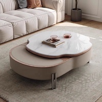 2024 nouveau salon ascenseur selle rotative en cuir table basse petit ménage créatif designer