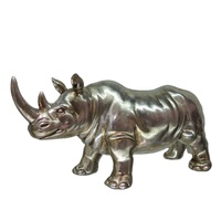 Statue de rhinocéros en résine dorée debout sur une roche, porte-bougie