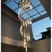Lobby d'hôtel européen Lampe suspendue en cristal à long tube Lustre d'escalier à haut plafond pour villas duplex et résidences hôtelières